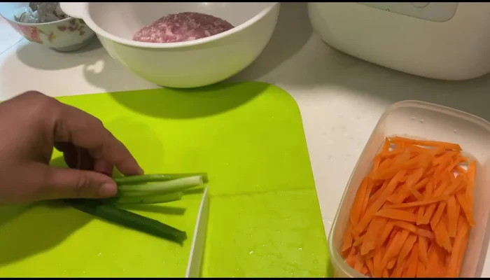 Prepare the pork filling: Mix the minced pork with chopped carrots, beans, spring onions, shrimp, egg white, pepper, and flour. Add oyster sauce and seasonings to taste.