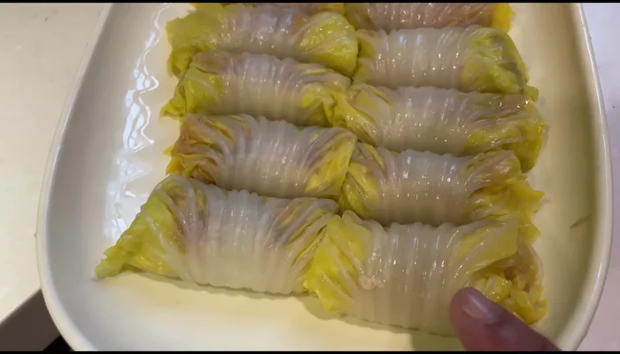 Steam the cabbage rolls: Steam the wrapped cabbage rolls until cooked through.