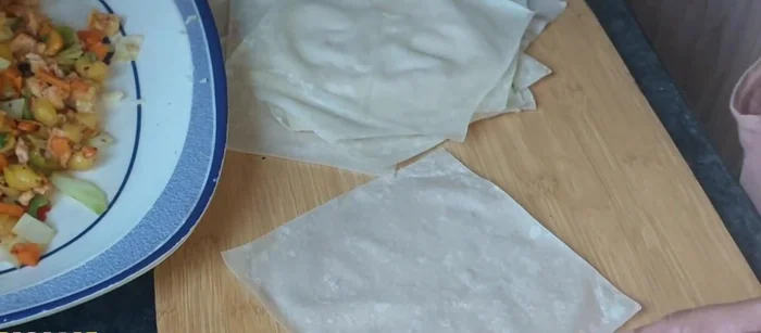 Fold the wonton wrapper into a cone shape, sealing the edges tightly to prevent leakage.