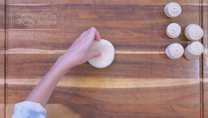 Flatten each piece into a 3 1/2 inch round pancake (1/4 inch thick).