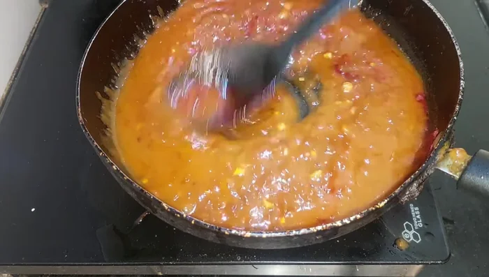 Add a little red food color and salt to taste. Mix well and cook until thickened.