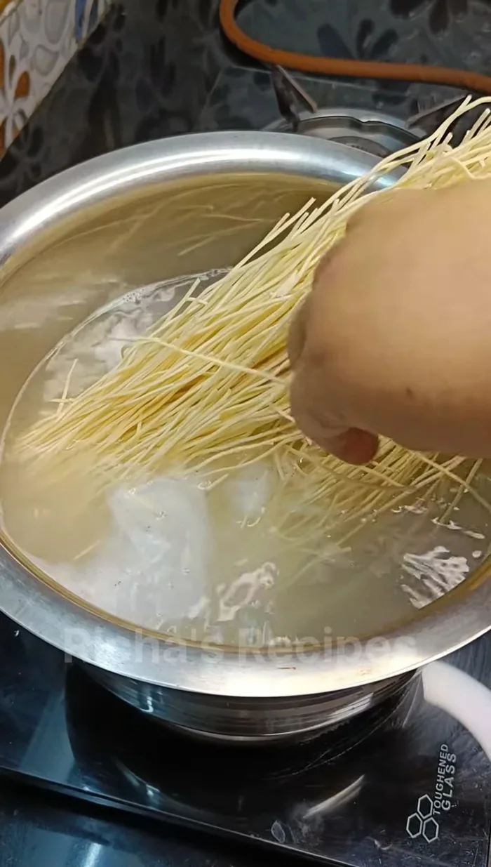 Boil water in a pot. Once boiling, add noodles and a pinch of salt and some oil. Cook for 4-5 minutes, ensuring they don't overcook.