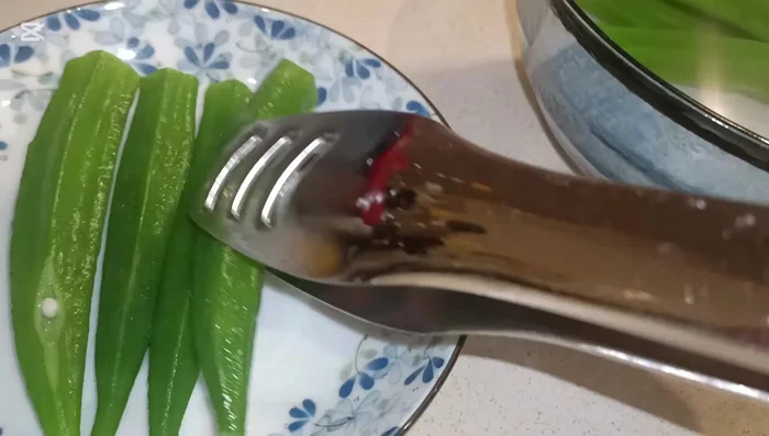 After a few seconds, remove lady fingers from cold water and place them on a plate.
