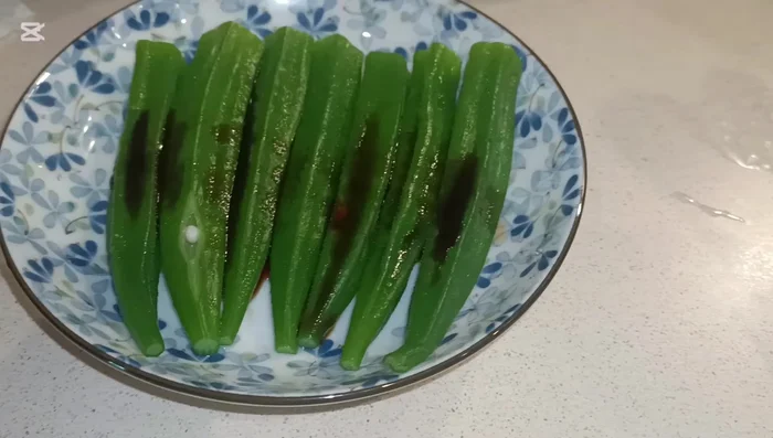 Add minced garlic and spring onion to the hot oil.