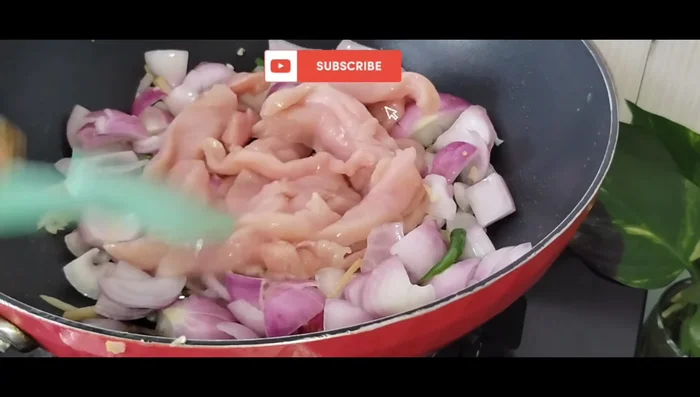 Add chicken breast and mix well. Add salt, chili flakes, oregano, and black pepper. Add a spoon of soy sauce and mix well.
