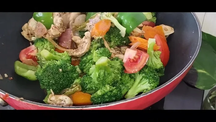 Add blanched broccoli and carrots, mix well, and add salt to taste. Cover and cook for fifteen minutes.