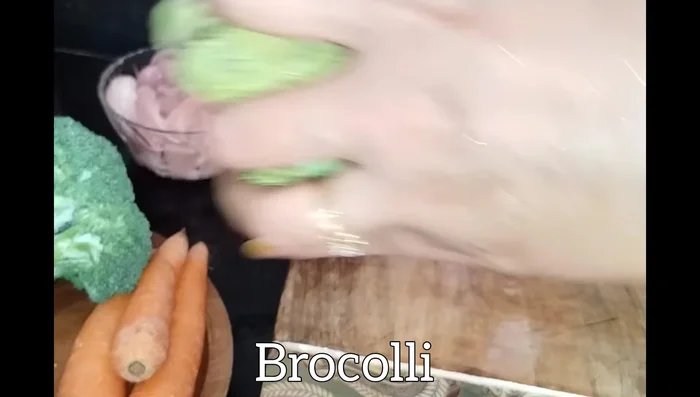 Cut broccoli into pieces, remove its stem, and put it in water to clean.