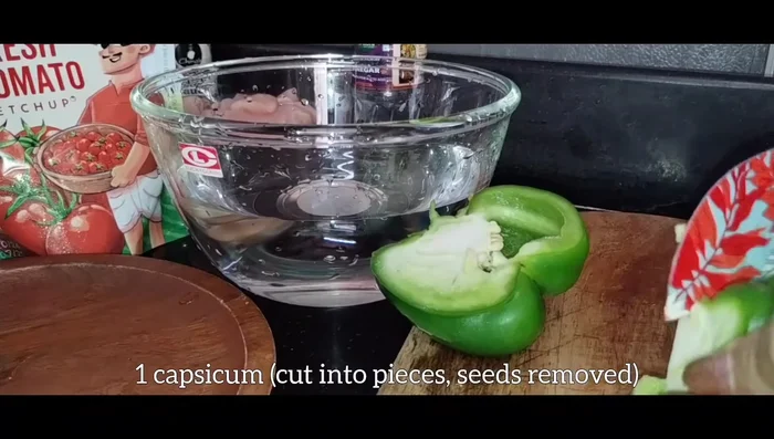 Cut capsicum into pieces, remove seeds, and thinly cut them into a good shape.