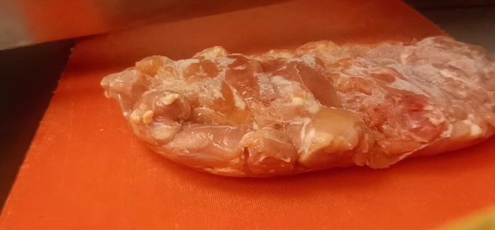 Clean and freeze the chicken. Once frozen, chop the chicken into small pieces.