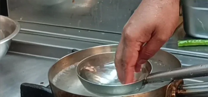 Prepare the dumpling dough (refer to the linked video in the description for detailed instructions).