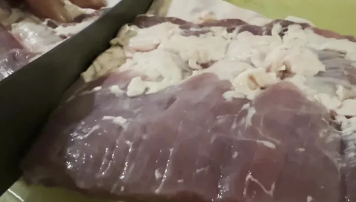Wash and cut the ribs into large slabs (3 slabs per rib).