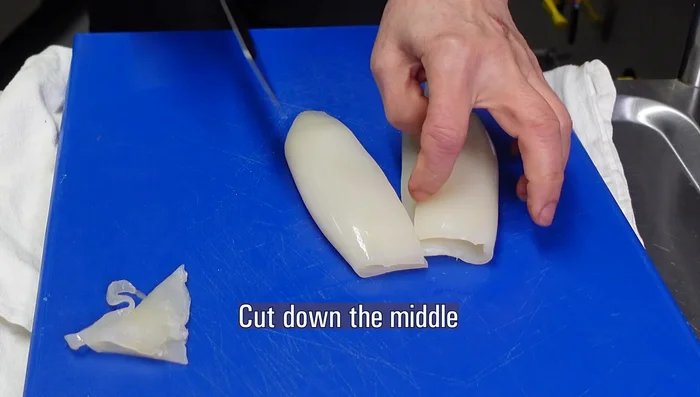 Clean and prepare the squid. Slice the whole squid into thin, triangular pieces. Discard the tough end parts. (82.88)