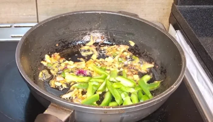 Add capsicum and other optional vegetables. Fry well.