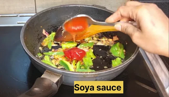 Add red chili powder (for color), tomato sauce, soy sauce, and vinegar. Fry until oil releases.