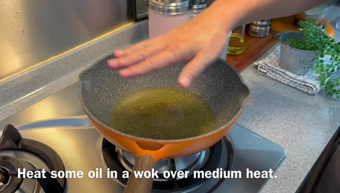 Heat up some oil in a frying pan over medium heat. Make sure the oil is hot enough – you should see bubbles rising when you test with a chopstick.