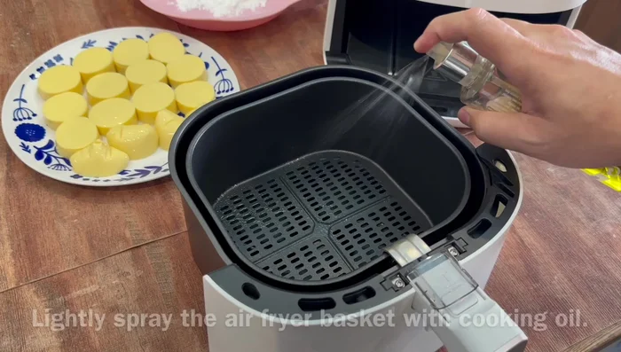 For the air-fried tofu: Spray oil onto the air fryer basket. Coat the remaining egg tofu (200g) in cornflour and spray with oil.
