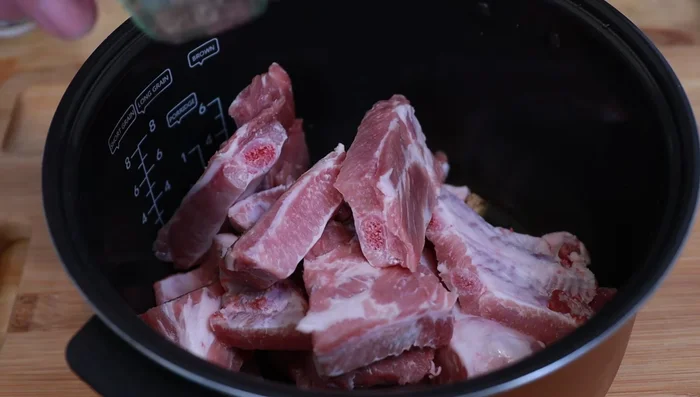 In a pot, combine ribs with black pepper, five-spice powder, ginger, garlic, star anise, hoisin sauce, yellow bean sauce (or extra hoisin), light soy sauce, dark soy sauce, honey, and white wine. Add water to cover.