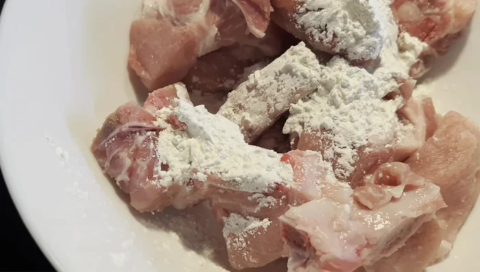 Coat pork chops in cornstarch.