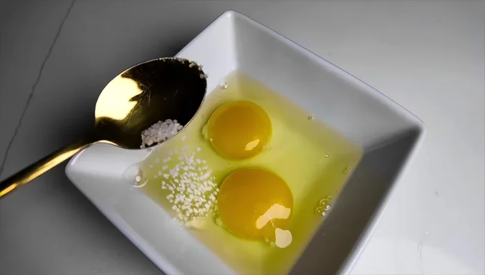 Whisk eggs with a little salt.