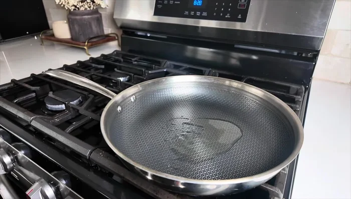 Heat oil in a pan over medium heat. Sauté white parts of spring onions and chopped onions for 2-3 minutes until translucent.