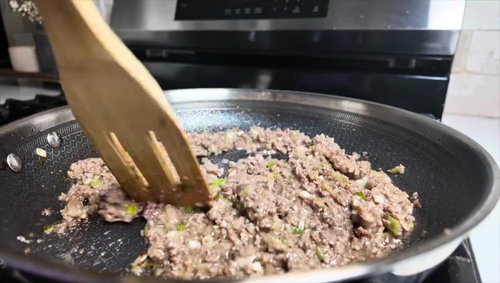 Add rice vinegar and stir well. Add dark soy sauce (optional) for color and simmer for a few minutes. Remove from heat and set aside.