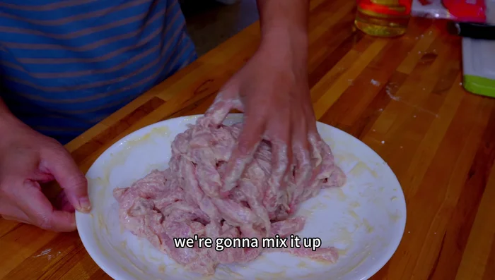 Add a little oil to the pork mixture. This helps create a loose and crispy crust.