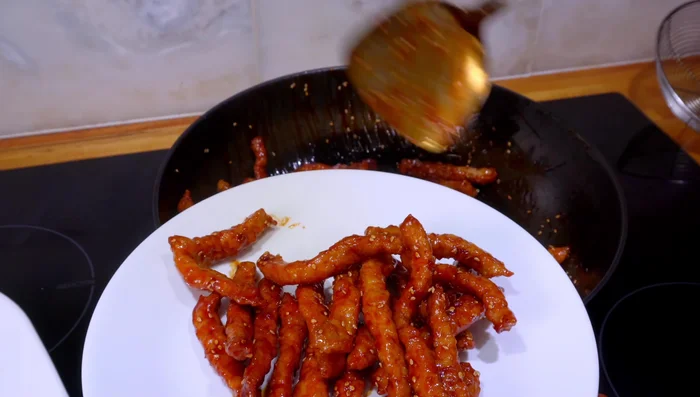 Garnish with roasted sesame seeds. Serve with Chinese lettuce and rice.