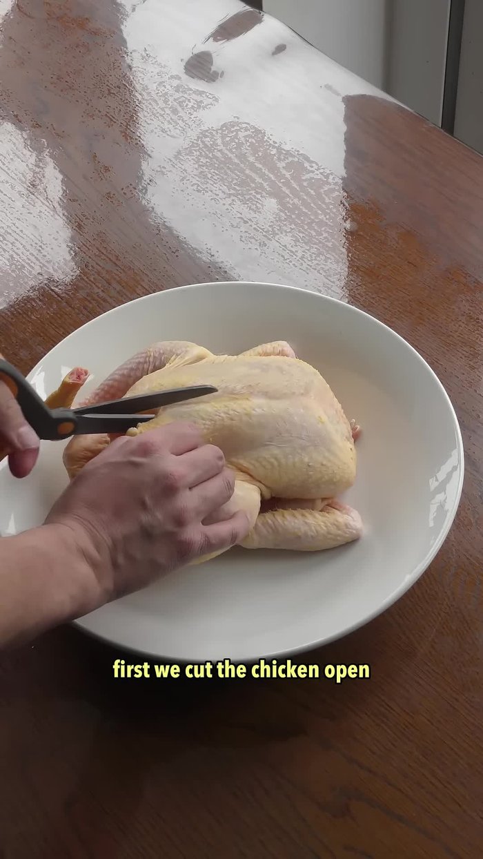 Cut the chicken open, following the breastbone. This Chinese style presentation reduces cooking time.