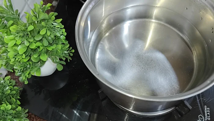Heat water in a pan. Add oil and salt.
