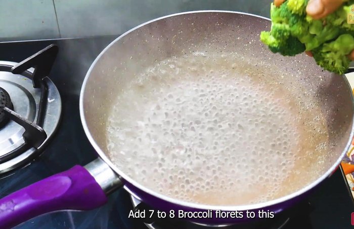 Blanch broccoli, carrots, and beans in boiling water with salt and sugar for 10 minutes. Immediately transfer to ice water to preserve color. (84.56)