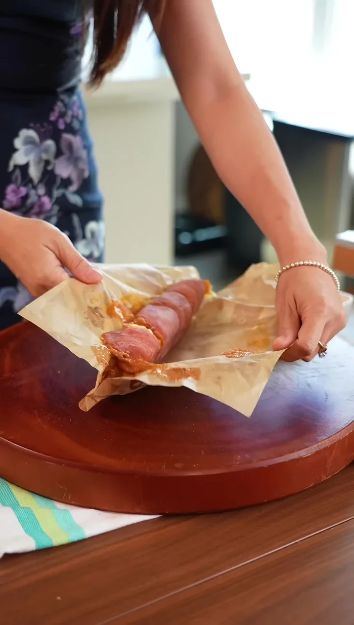 Remove the plastic wrap and cut the roll into sushi-like pieces.