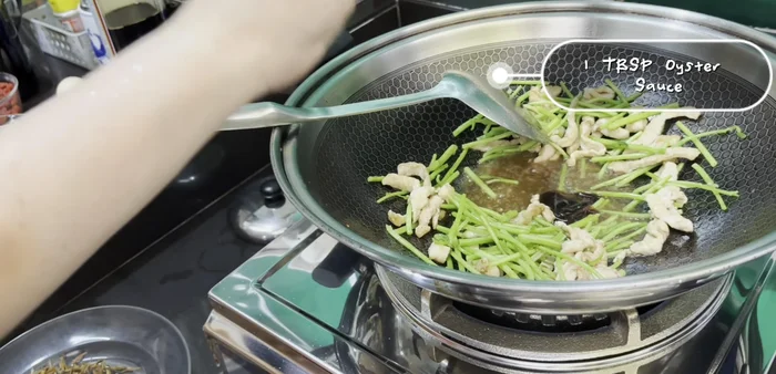 Add oyster sauce and chicken stock/water. Cover and simmer for 3 minutes.
