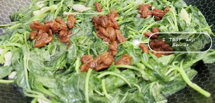 Add goji berries and Shaoxing wine.