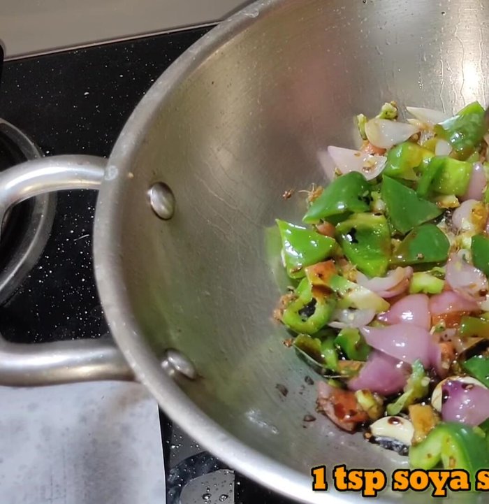 Add red chili sauce, soy sauce, tomato sauce, vinegar, salt, and optional Schezwan chutney. Mix well.