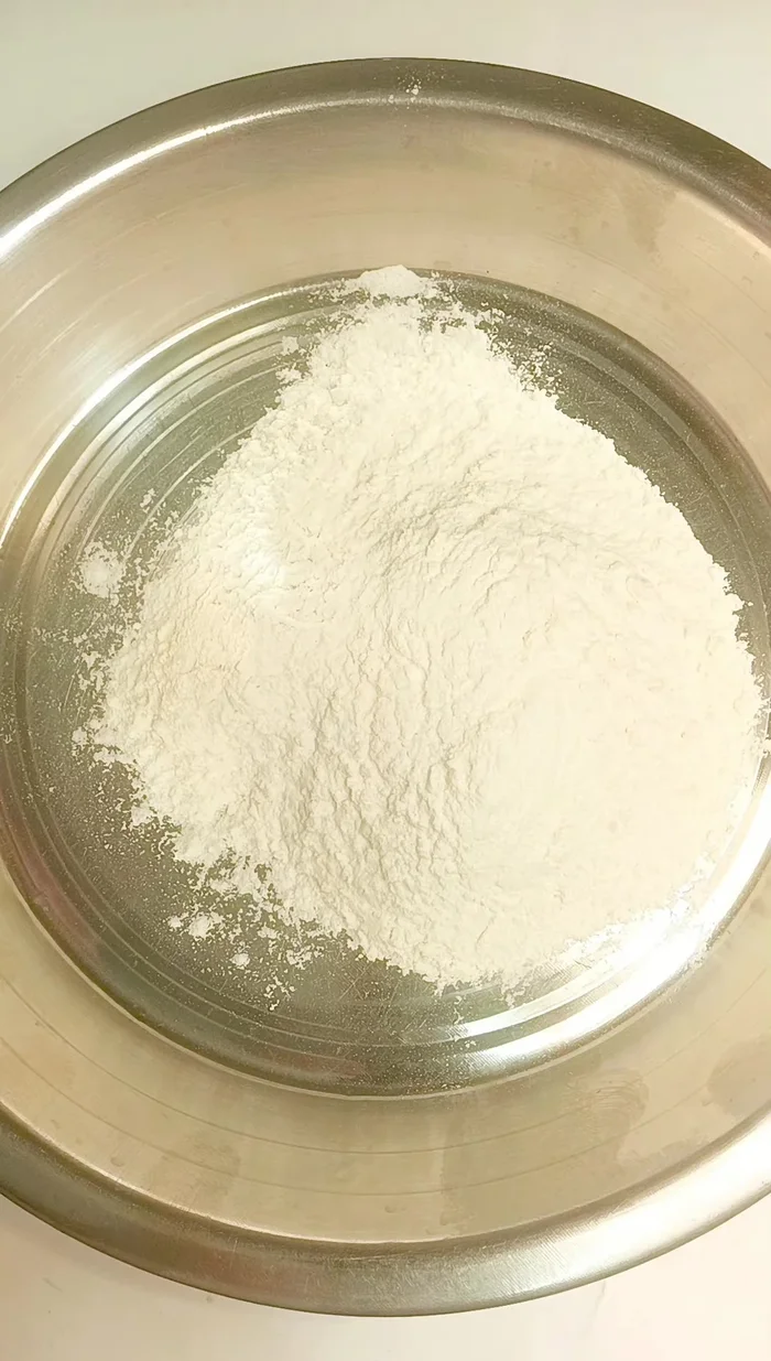 Prepare the spring roll batter: Mix 2 cups of flour, salt to taste, and 2 tablespoons of refined oil. Knead with water to form a roti-like dough. Let it rest for at least 5 minutes (covered).