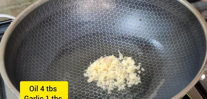 In a pan, fry 4 tablespoons of oil and 1 tablespoon of chopped garlic. Add 1 cup of chopped carrots and cook on high flame until slightly soft.