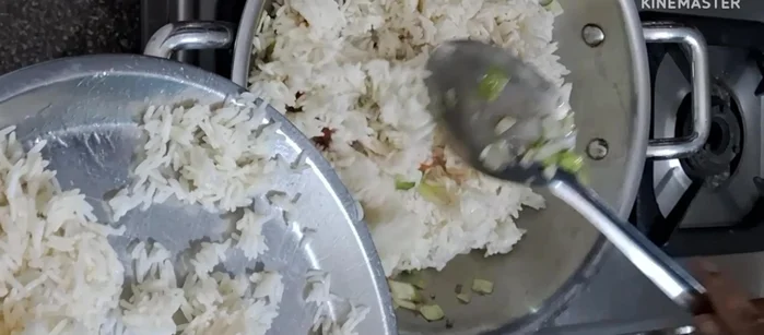 Add the cooked rice (leftover rice is fine) and mix well.