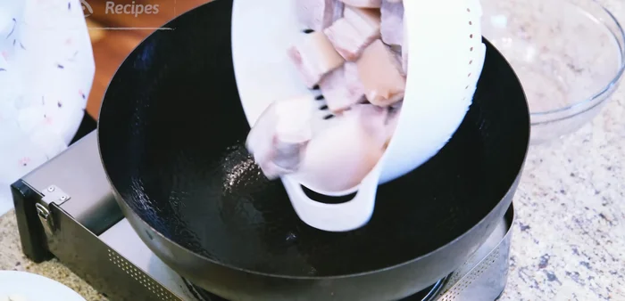 In a wok, stir-fry the pork belly until 1-2 tbsp of fat is rendered.