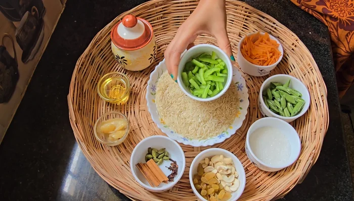 Prepare rice: Wash and soak basmati rice for 30 minutes. Add bay leaves, cardamom, cloves, cinnamon, and a few drops of oil. Boil until 90% cooked, then drain.