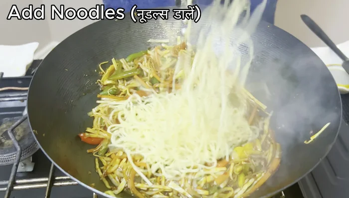 Add the boiled noodles and toss everything together thoroughly.
