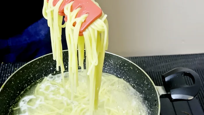 Heat oil in a wok or large pan.