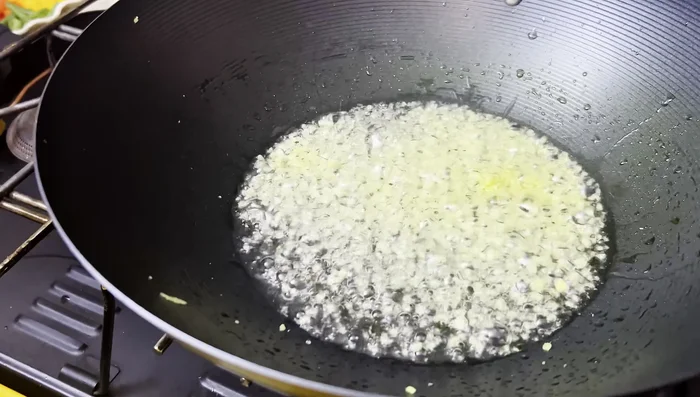 Sauté ginger for 15-20 seconds until lightly browned.