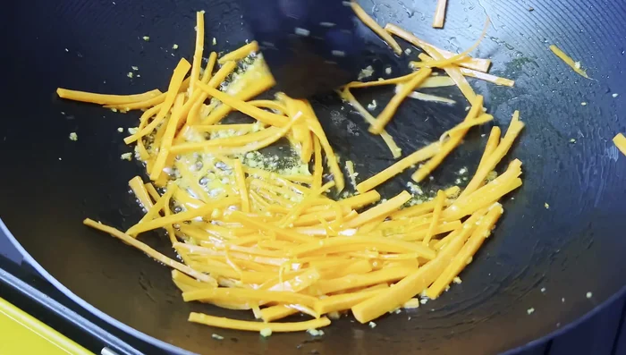 Add carrots and sauté for ½ - 1 minute.