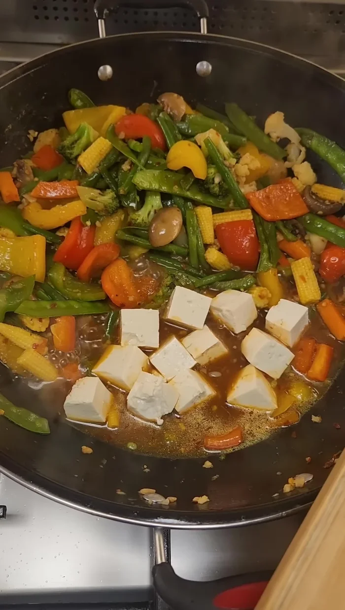 Add semi-soft tofu (or your choice of tofu/paneer).