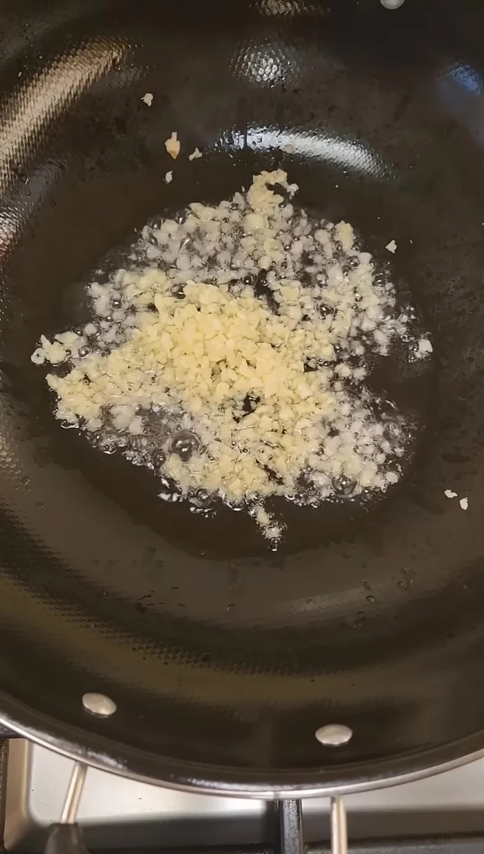 Heat a big pan, add oil, then crushed garlic and sauté.