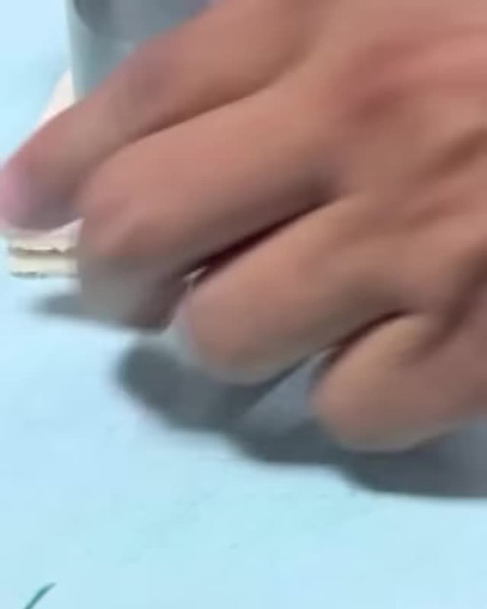 Cut readymade dumpling sheets into pieces (one by two) using a glass cutlery.