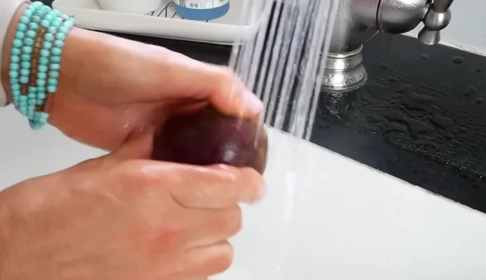 Wash the beets under cold water and scrub the exterior with your thumb.