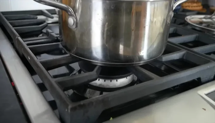 Add a couple of inches of water to the bottom of a pot. Bring the water to a boil on high heat, then reduce to a simmer.