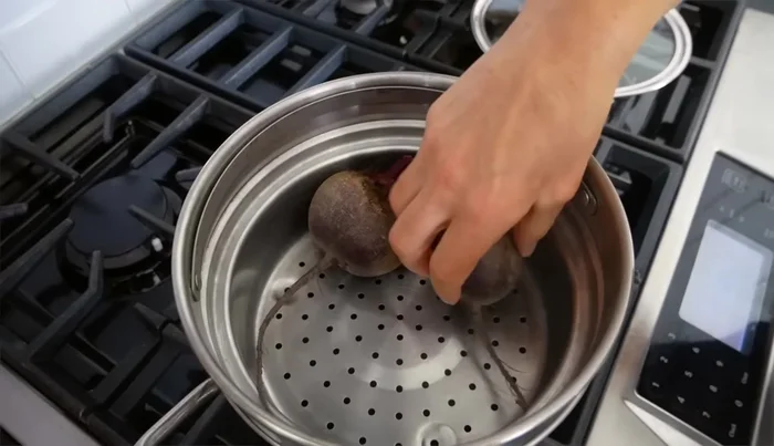 Place the beets in the steamer basket and set it in the pot. Cover and steam for 30 minutes, or until a knife pierces easily. The beets should be vibrant in color.