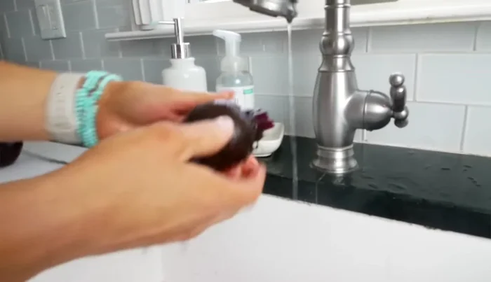 Run the beets under cold water to cool them further and make peeling easier. The skins should slip off easily.